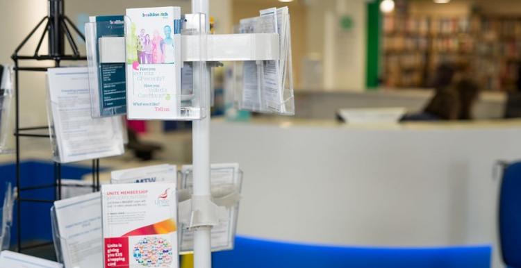 leaflets on a stand in a waiting room