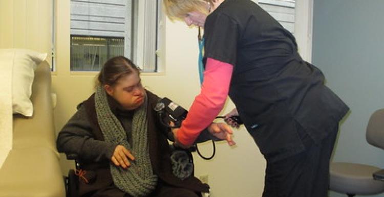 Image of nurse taking someone's blood pressure