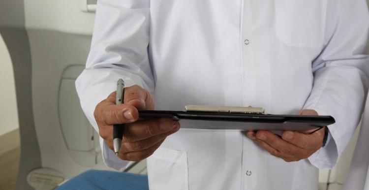 Doctor holding clipboard