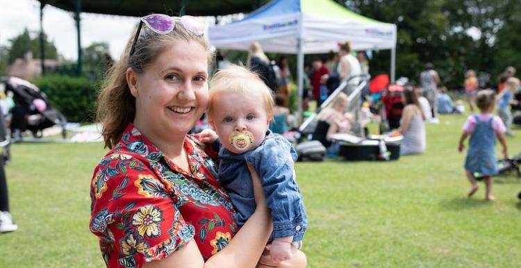 A mother and baby looking at the camera