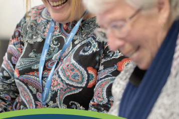 Two women smiling on the front cover of our annual report