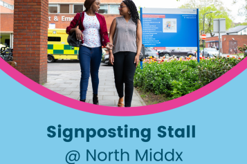 Banner to advertise signposting stall at North Middx. Tho back women walking one hospital premises on a sunny day, chatting.