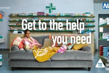 NHS Winter Wellness advert. Woman lying down on sofa, warm.