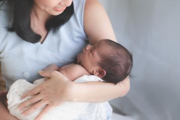 Mother holding newborn child