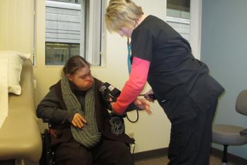 Image of nurse taking someone's blood pressure