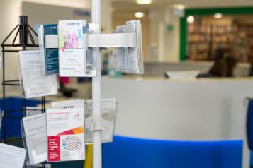 leaflets on a stand in a waiting room