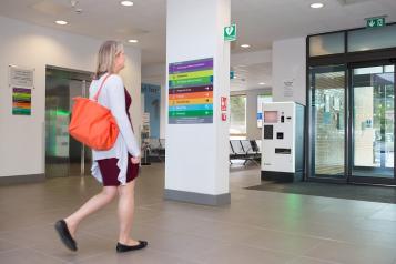 Lady walking out of a hospital