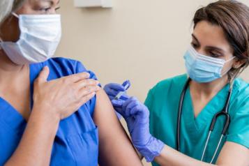 person having their covid vaccine