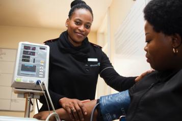 Women administering a blood pressure check